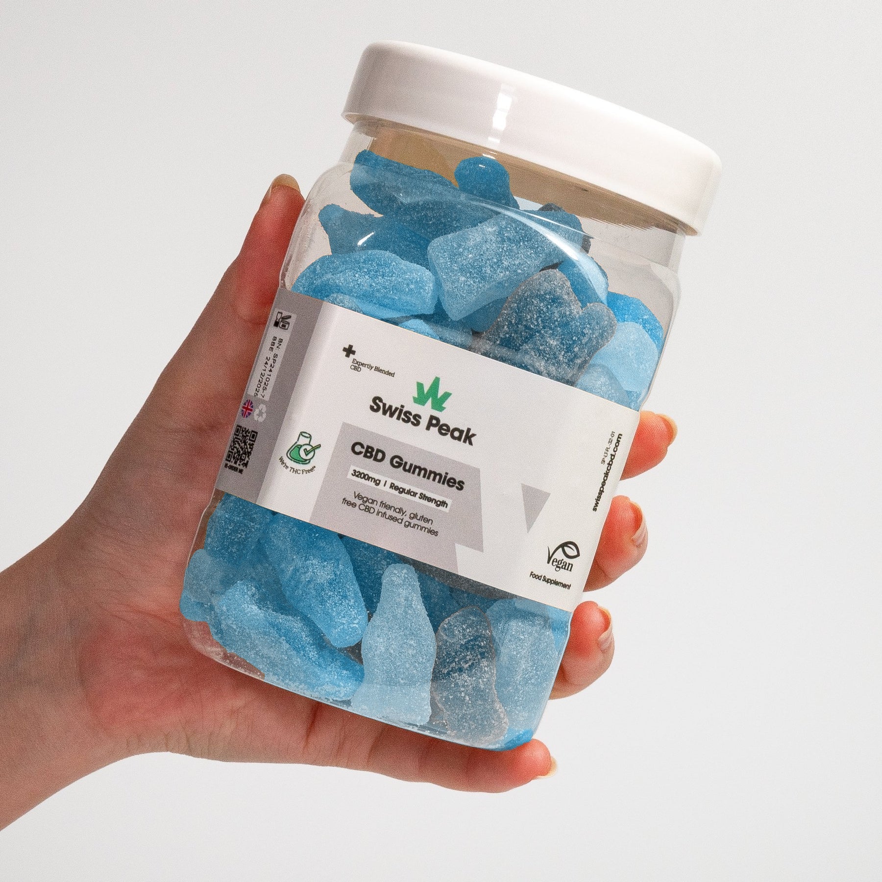 Hand holding jar of CBD Bottles Gummies 3200mg - 4800mg - Swiss Peak