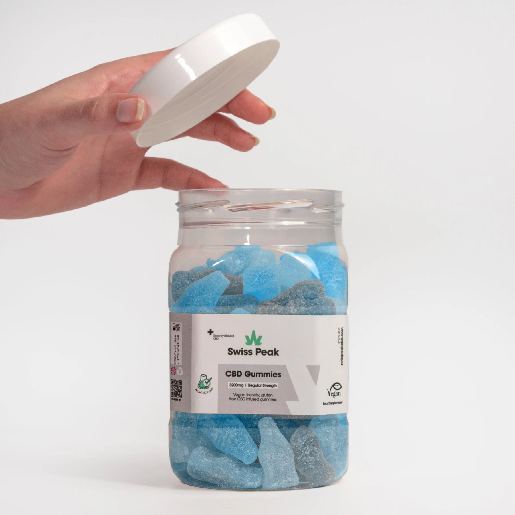 Hand opening jar of CBD Bottles Gummies 3200mg - 4800mg - Swiss Peak