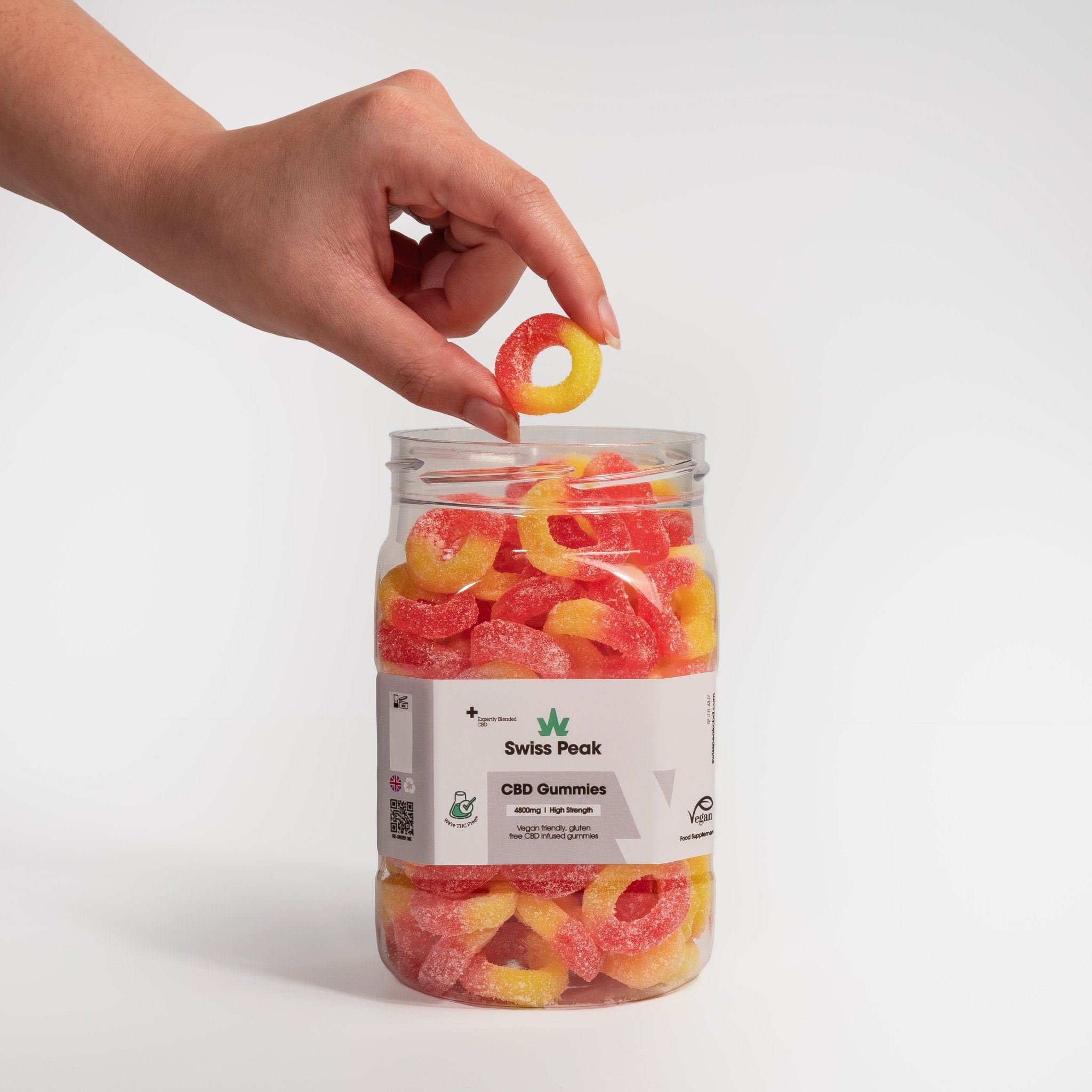 Hand holding CBD Peach Ring Gummies 3200mg - 4800mg - Swiss Peak 02