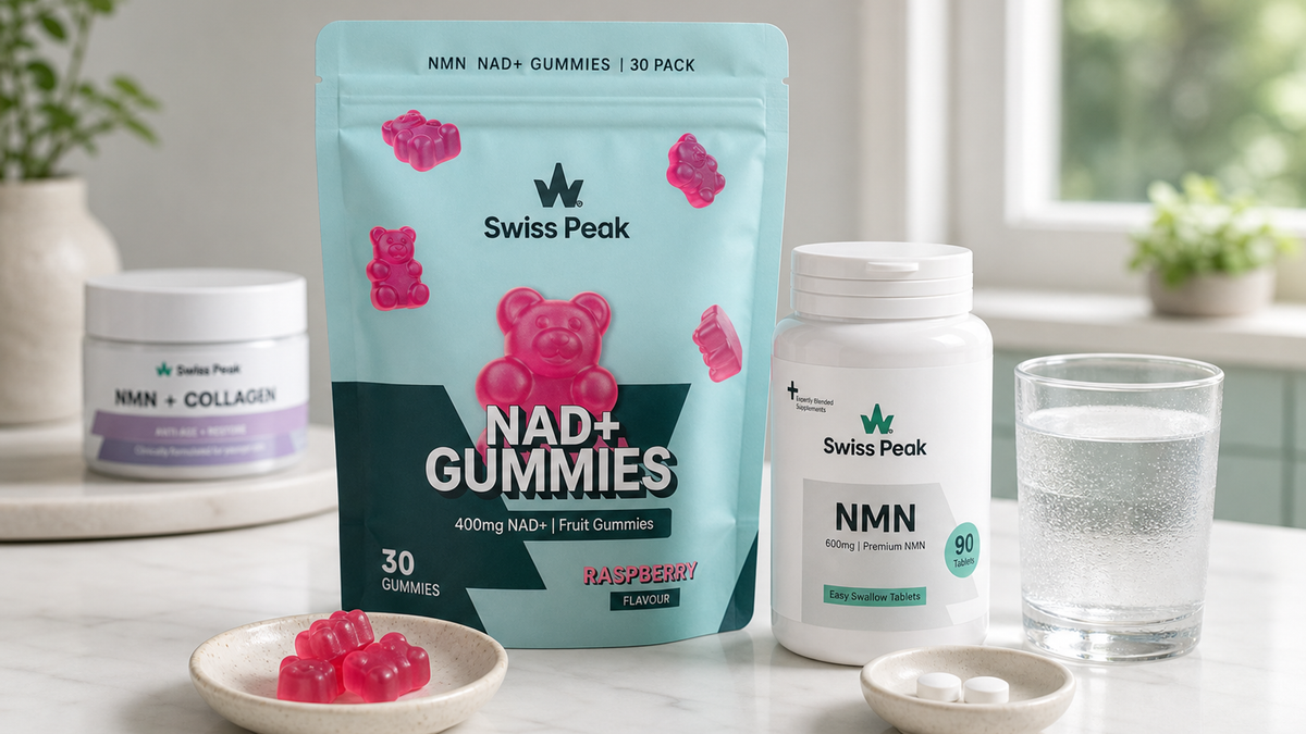 Close-up of UK-made NMN and NAD+ supplements in tablet, gummy and capsule formats on a clean white background with a glass of water.