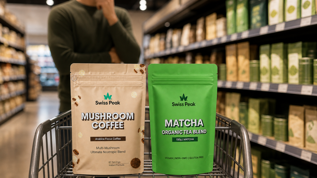 Side‑by‑side overhead of a steaming mug of mushroom coffee and a whisked bowl of vivid green matcha on a clean countertop.